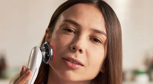 Woman combining acne medication and beauty device safely on skin