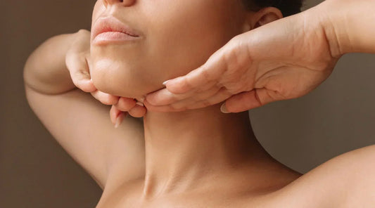 Woman demonstrating natural face and neck rejuvenation techniques