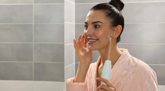 Woman with glowing skin after using a high frequency wand at home