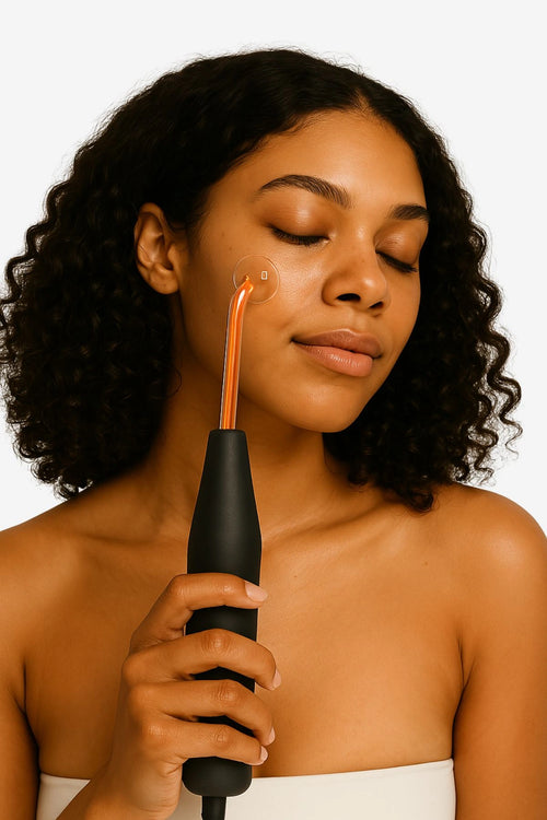 Woman using a high frequency wand for glowing skin at home – best device for anti-aging and acne treatment